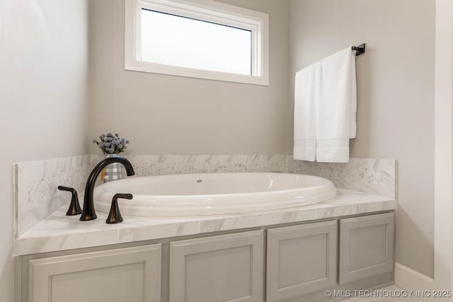 full bathroom with a garden tub