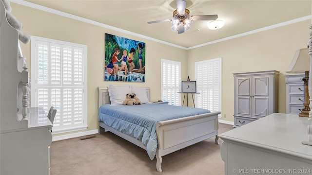 bedroom featuring ornamental molding, ceiling fan, and carpet floors