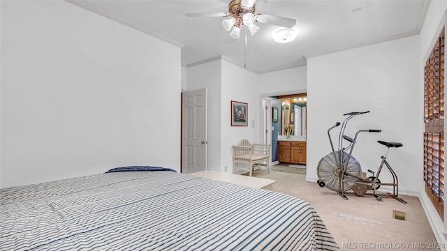 carpeted bedroom with ornamental molding and ceiling fan