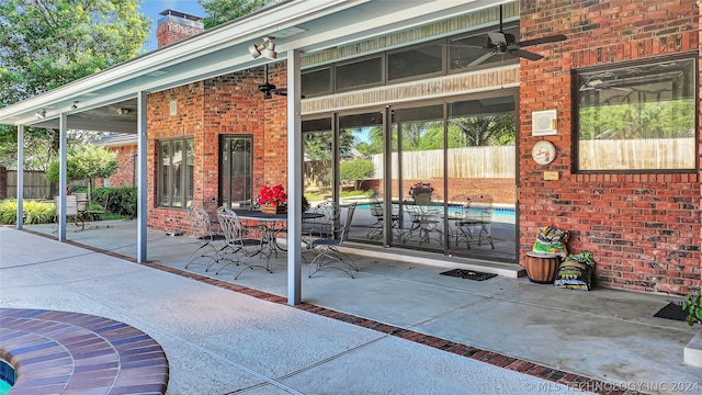 view of patio / terrace featuring ceiling fan