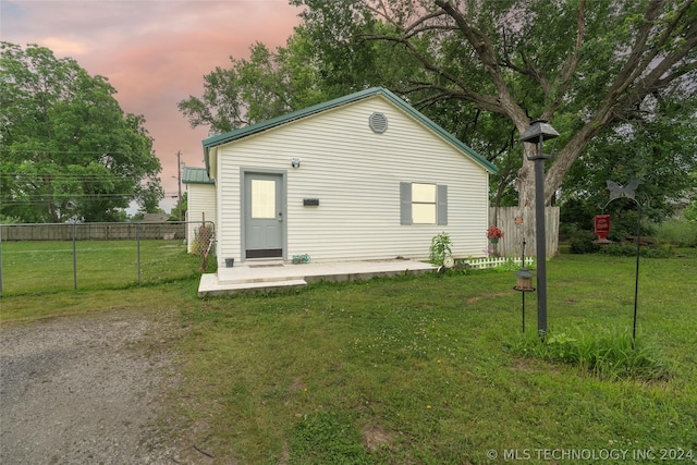 view of front of house with a lawn