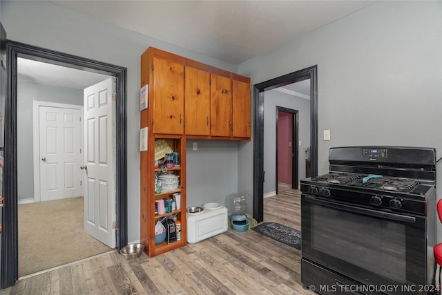 kitchen featuring light hardwood / wood-style flooring and gas stove