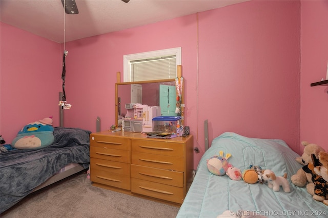 bedroom with ceiling fan and light carpet