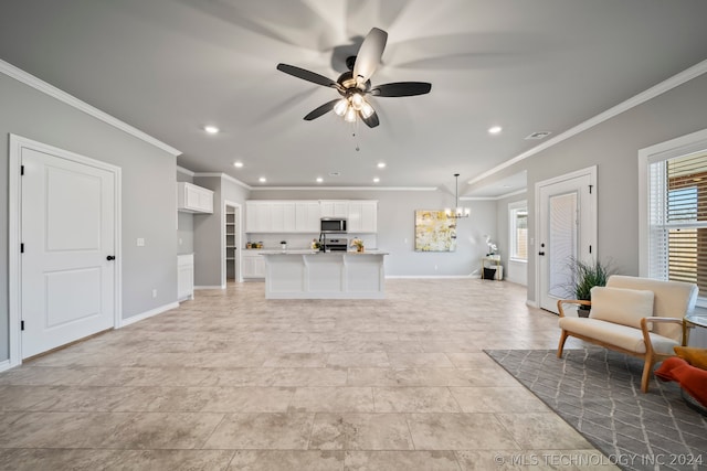 living room featuring ceiling fan with notable chandelier, crown molding, and light tile floors