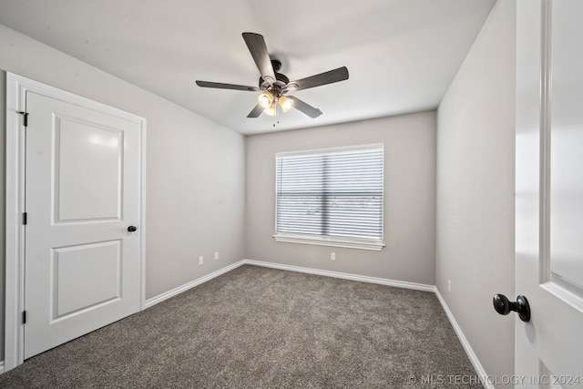 empty room with carpet flooring and ceiling fan