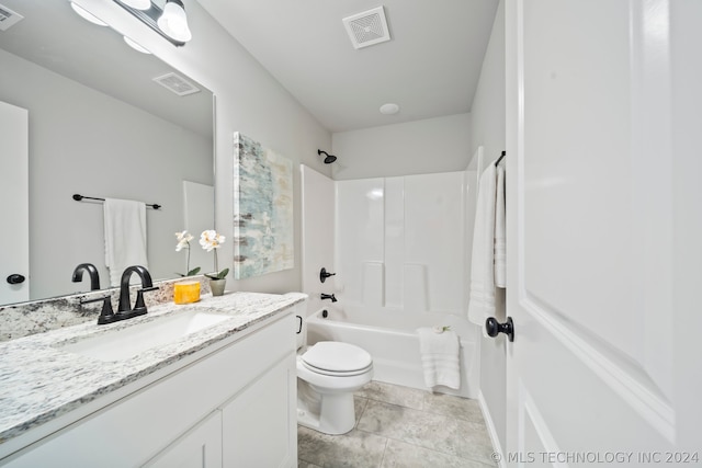 full bathroom with bathing tub / shower combination, toilet, tile floors, and large vanity