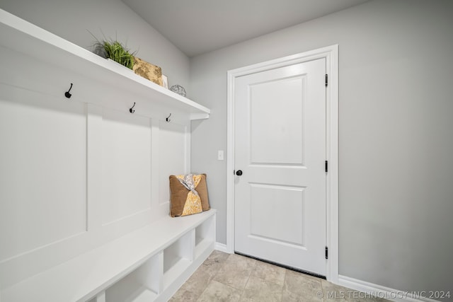 mudroom with light tile floors