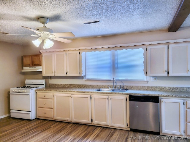 kitchen with white gas range, sink, beamed ceiling, dishwasher, and light hardwood / wood-style floors