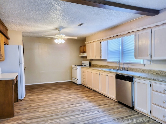 kitchen featuring white appliances, sink, ceiling fan, light hardwood / wood-style floors, and white cabinetry