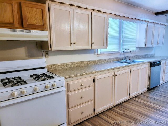 kitchen with white cabinets, sink, light hardwood / wood-style flooring, dishwasher, and white range with gas stovetop