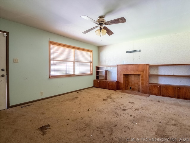 spare room featuring carpet floors and ceiling fan