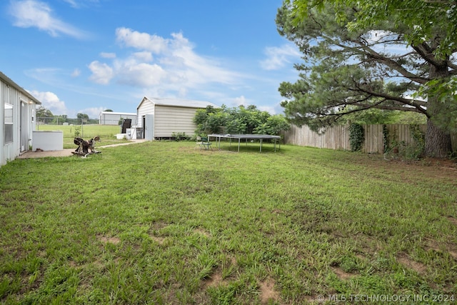 view of yard with a trampoline