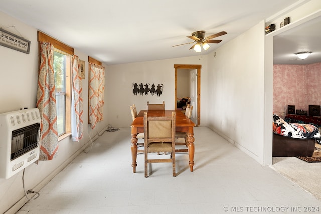 tiled dining room with ceiling fan and vaulted ceiling