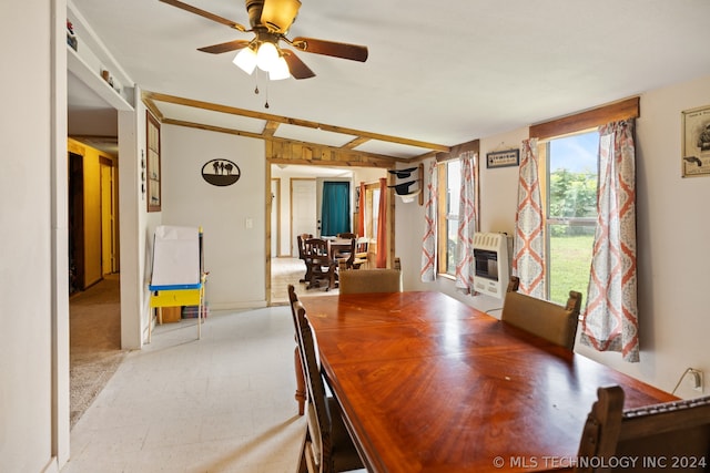 carpeted dining room featuring ceiling fan