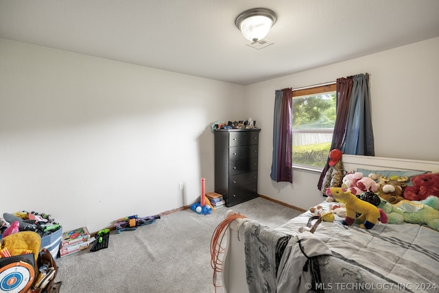 bedroom with light colored carpet