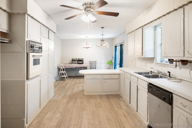 kitchen featuring light wood-type flooring, stainless steel dishwasher, wall oven, kitchen peninsula, and sink