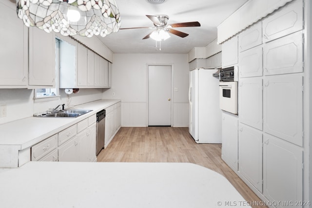 kitchen featuring ceiling fan, white appliances, light wood-type flooring, sink, and white cabinets