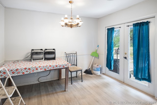 bedroom with a chandelier, ornamental molding, access to exterior, and light hardwood / wood-style flooring