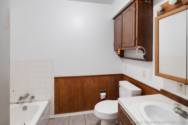 bathroom featuring tile flooring, vanity, and toilet