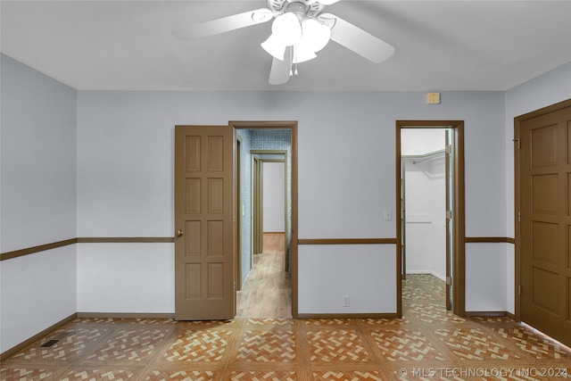 spare room with ceiling fan and light hardwood / wood-style floors