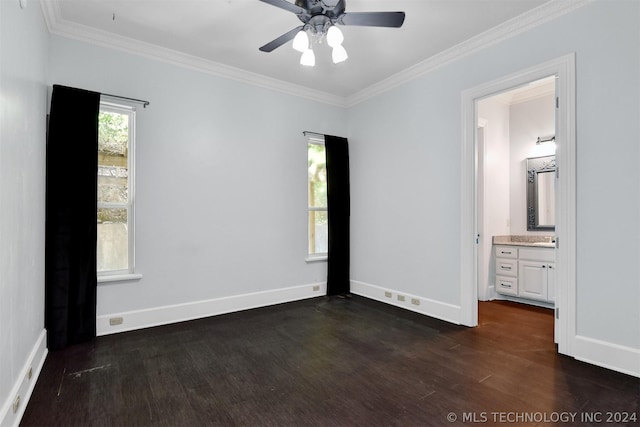 unfurnished bedroom with ceiling fan, dark hardwood / wood-style flooring, crown molding, and ensuite bath