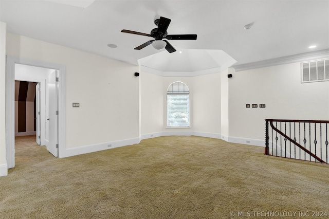 spare room with ceiling fan and light colored carpet