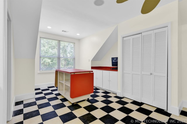 unfurnished office featuring ceiling fan