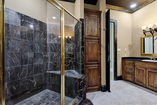 bathroom with vanity, a tile shower, and crown molding