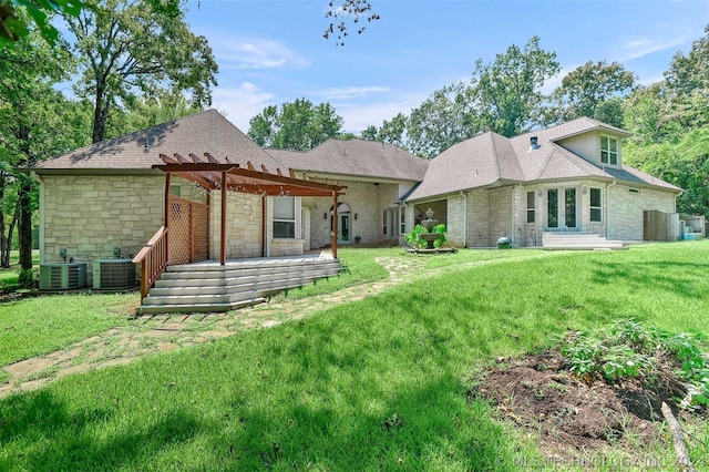 back of house featuring a pergola, a lawn, and cooling unit