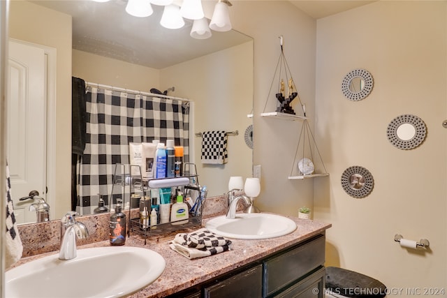 bathroom featuring vanity and a shower with shower curtain