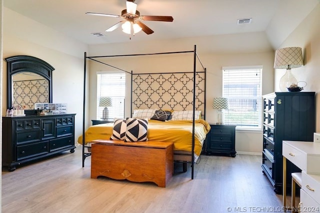 bedroom with ceiling fan and light hardwood / wood-style flooring