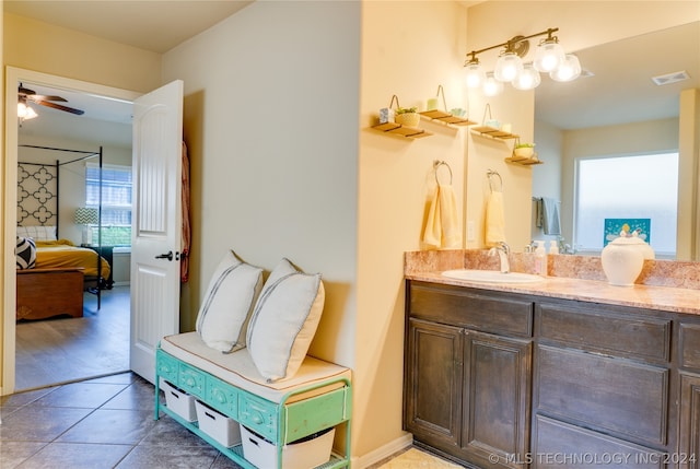 bathroom featuring tile patterned floors, ceiling fan, and vanity