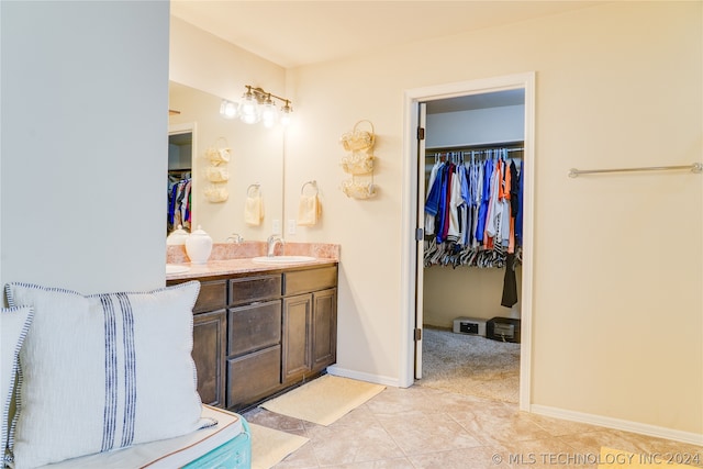 bathroom with tile patterned flooring and vanity