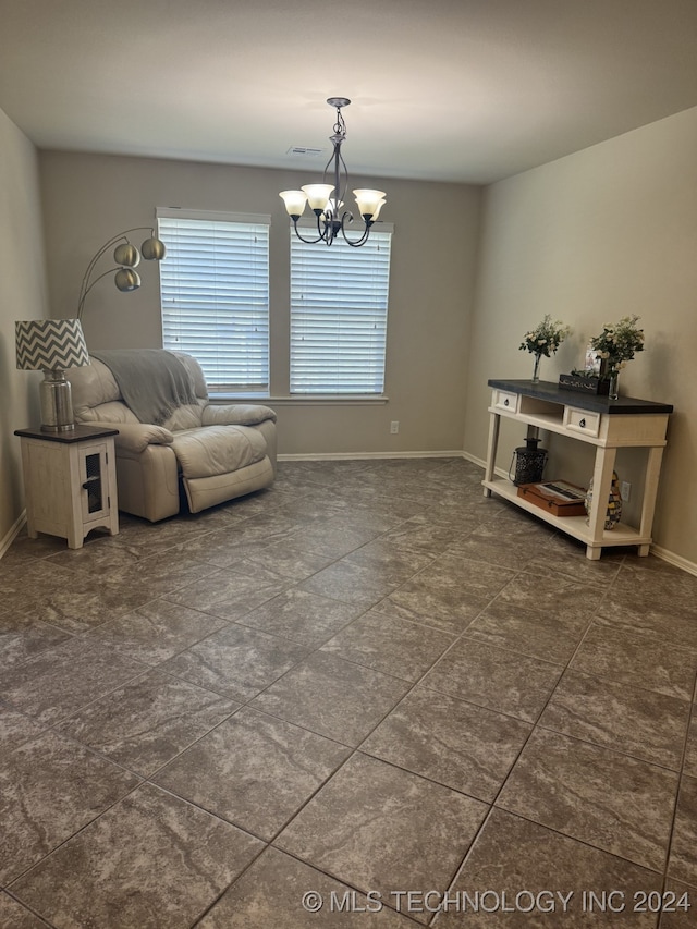 living area featuring a notable chandelier