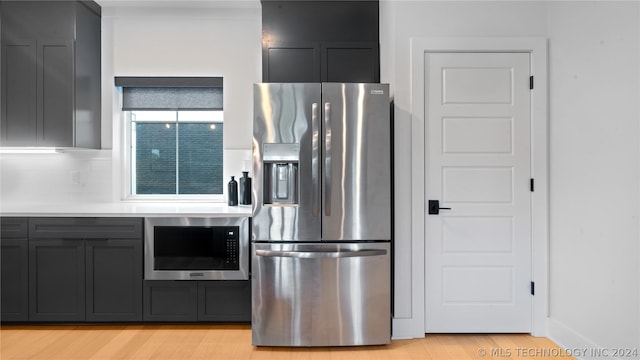 kitchen with light hardwood / wood-style flooring and stainless steel appliances