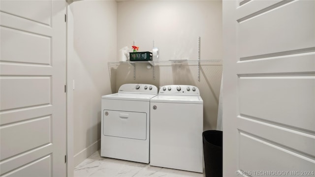 clothes washing area featuring independent washer and dryer