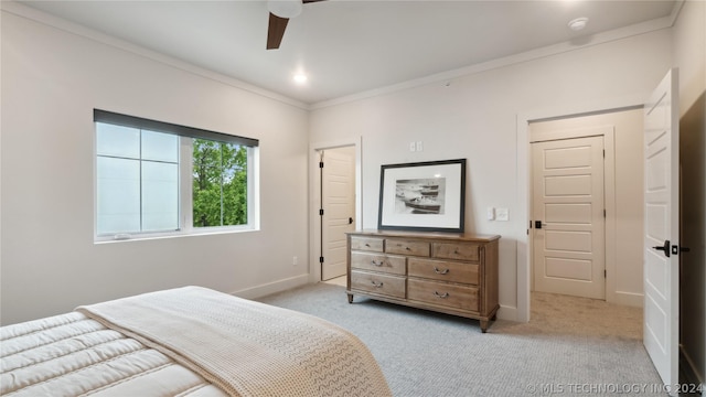 bedroom with light carpet, ceiling fan, and ornamental molding