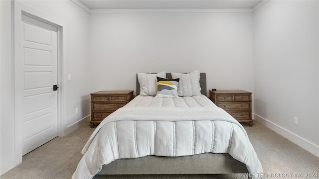 carpeted bedroom featuring crown molding