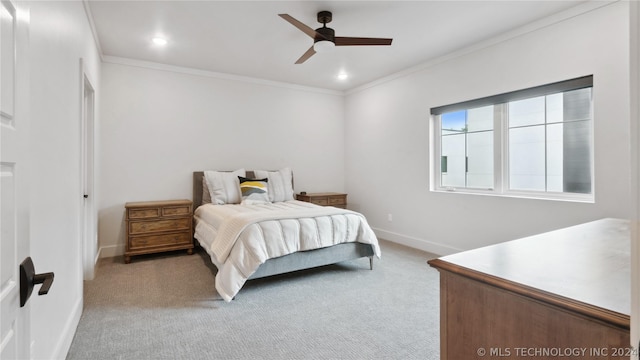 bedroom with ceiling fan, crown molding, and light carpet