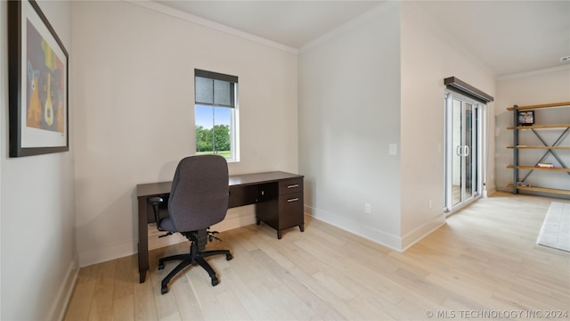 home office with light hardwood / wood-style floors and ornamental molding