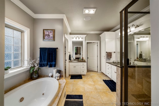 bathroom with a textured ceiling, ornamental molding, vanity, tiled bath, and tile patterned flooring