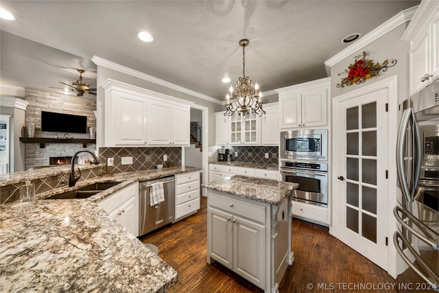 kitchen featuring white cabinetry, appliances with stainless steel finishes, and a kitchen island