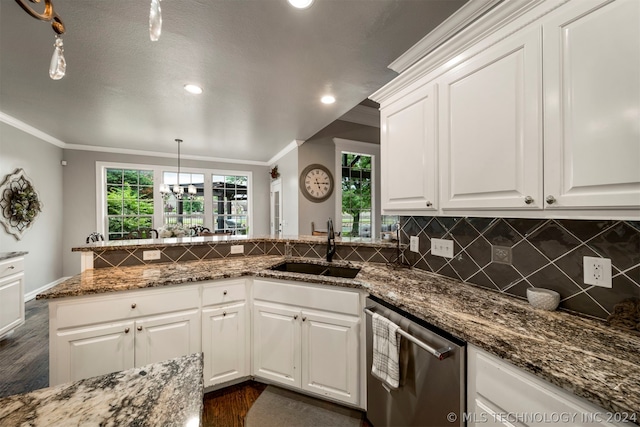 kitchen featuring dishwasher, dark wood-type flooring, sink, pendant lighting, and white cabinetry