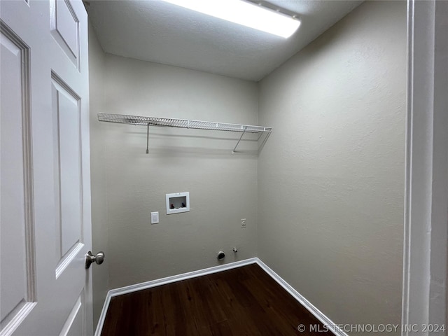 washroom with hardwood / wood-style floors, hookup for a gas dryer, and hookup for a washing machine