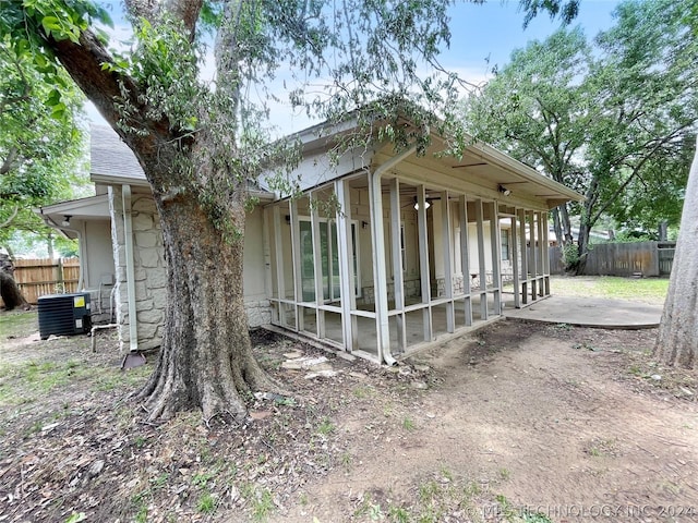 view of home's exterior with a patio area and central air condition unit