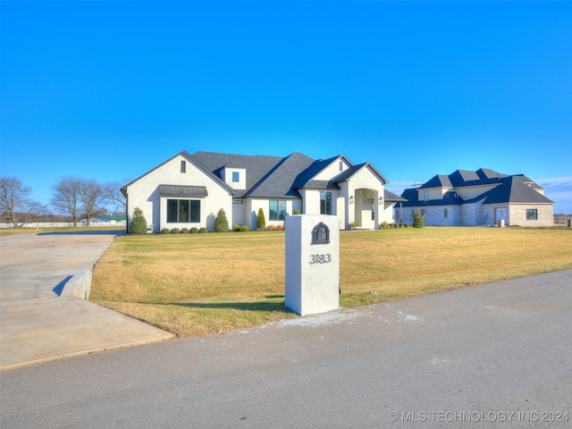 view of front of home with a front yard