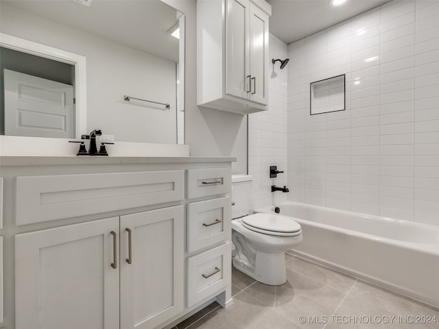 full bathroom with tile patterned floors, vanity, toilet, and tiled shower / bath