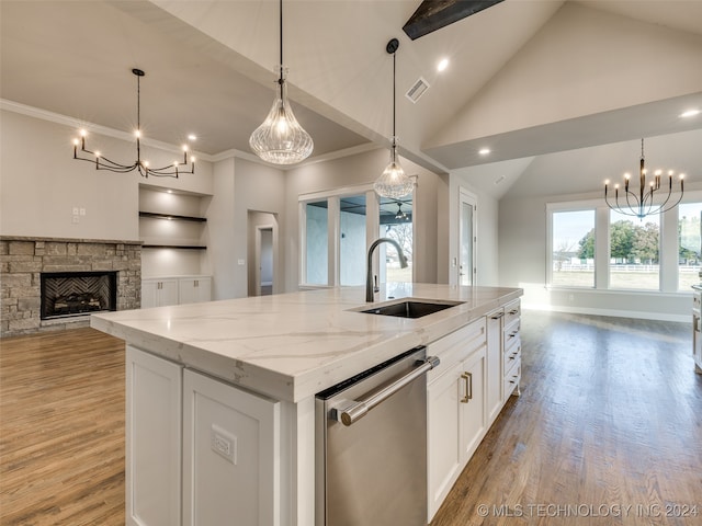 kitchen with dishwasher, sink, an island with sink, light hardwood / wood-style floors, and white cabinets