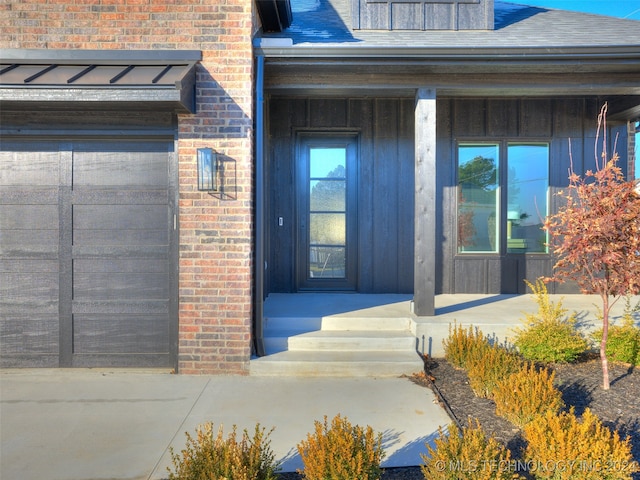 view of exterior entry featuring a porch