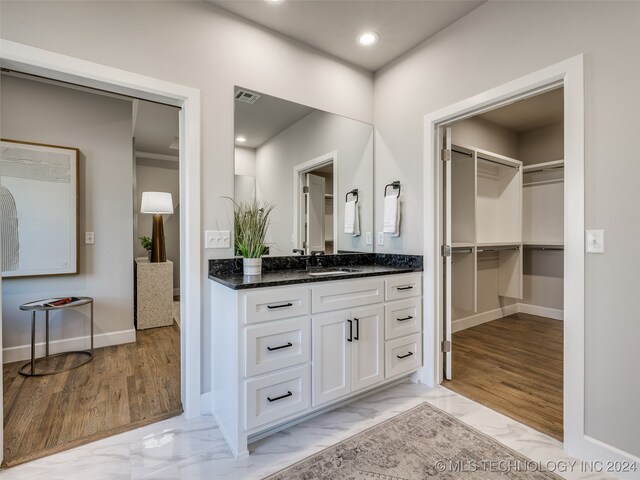 bathroom featuring hardwood / wood-style floors and vanity